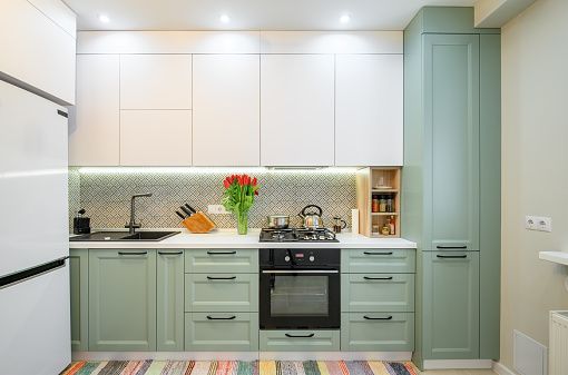 Add Contrast with Black Appliances - 10 Cool and Fabulous Green Kitchen Ideas