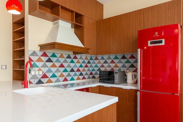 Photo by Max Rahubovskiy kitchen-interior-with-colorful-tiles-and-red-refrigerator-7173671