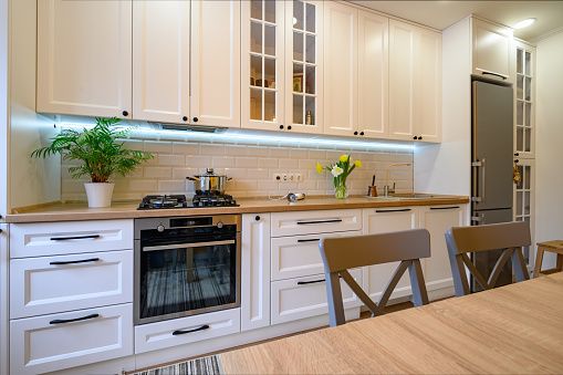 Under-cabinet lighting - White Kitchen Cabinets