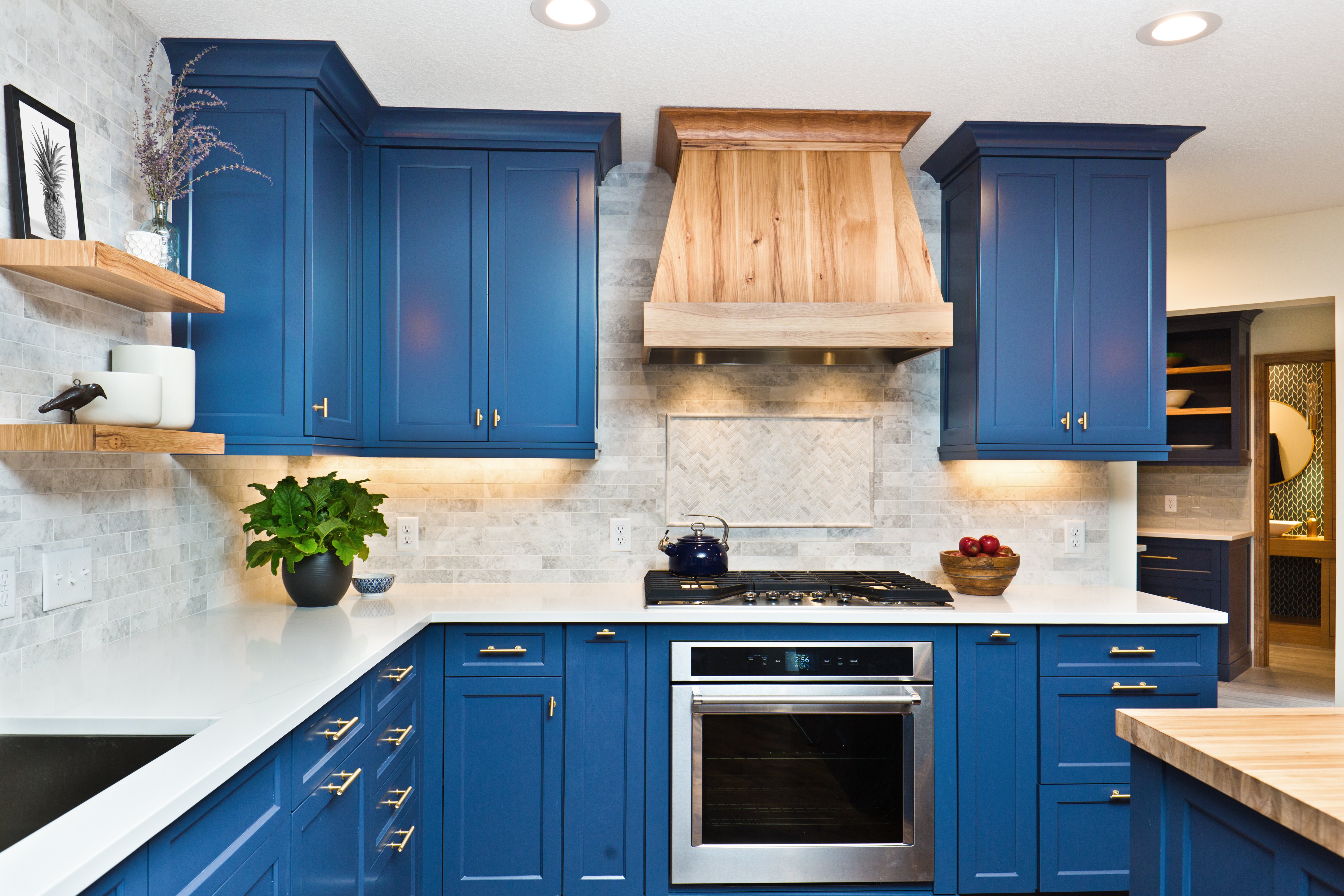 12 kitchens with shaker cabinets to inspire your own:3 Navy blue shaker cabinets with brass hardware.